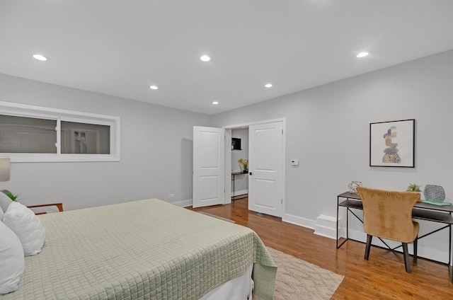 bedroom with hardwood / wood-style floors