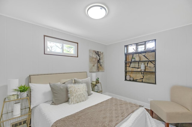 bedroom with multiple windows and ornamental molding