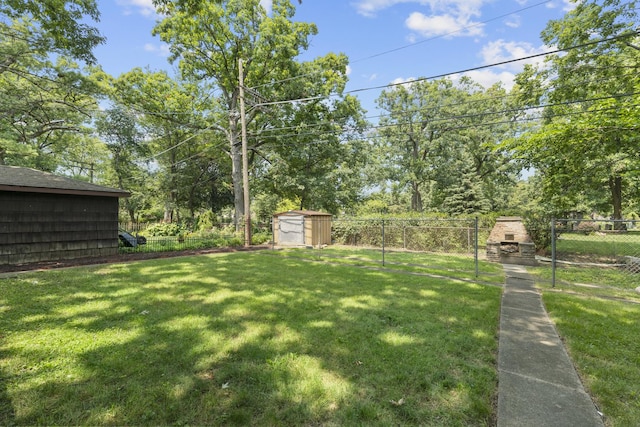 view of yard featuring a shed and exterior fireplace