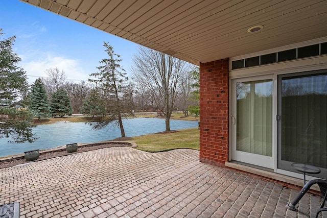 view of patio / terrace featuring a water view