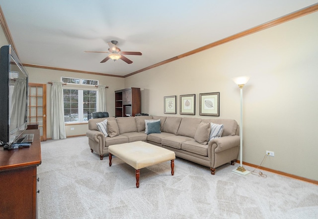 living room featuring ornamental molding, light carpet, and ceiling fan