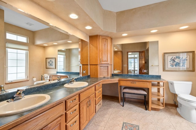 bathroom with vanity, tile patterned floors, and toilet