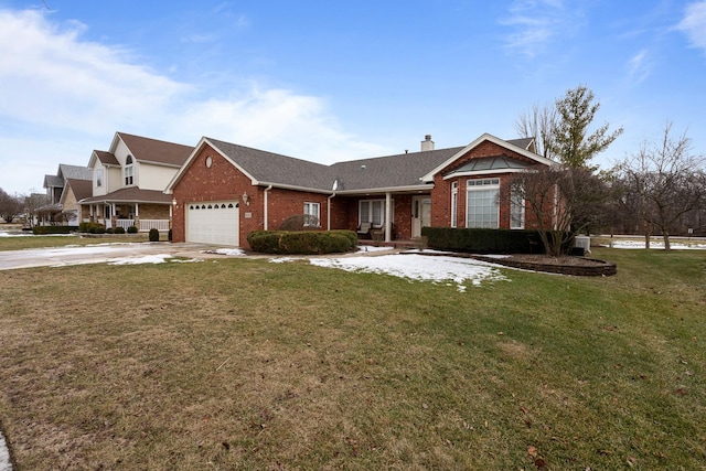 ranch-style house featuring a garage and a front lawn