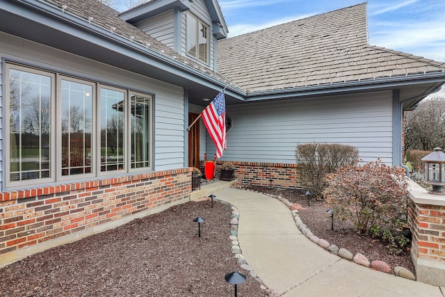 exterior space with brick siding