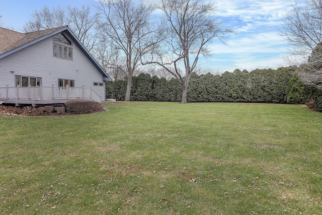 view of yard with a wooden deck
