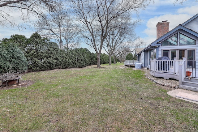 view of yard featuring a wooden deck