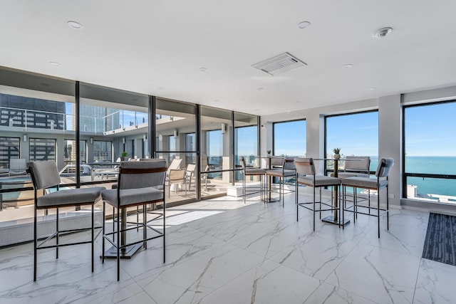 sunroom with a water view