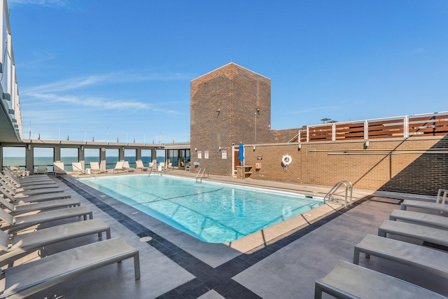 view of swimming pool featuring a patio