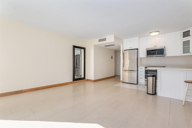 kitchen featuring white cabinets and stainless steel appliances