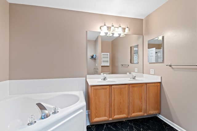 bathroom featuring a tub to relax in and vanity