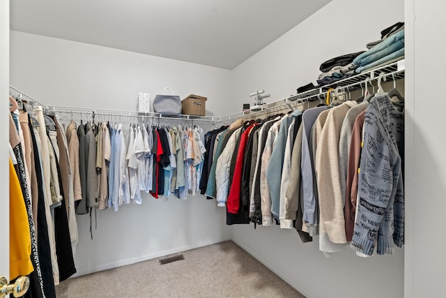 walk in closet featuring carpet