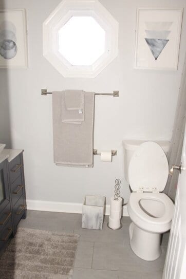 bathroom featuring tile patterned floors, vanity, and toilet