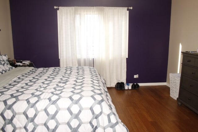 bedroom featuring dark wood-type flooring