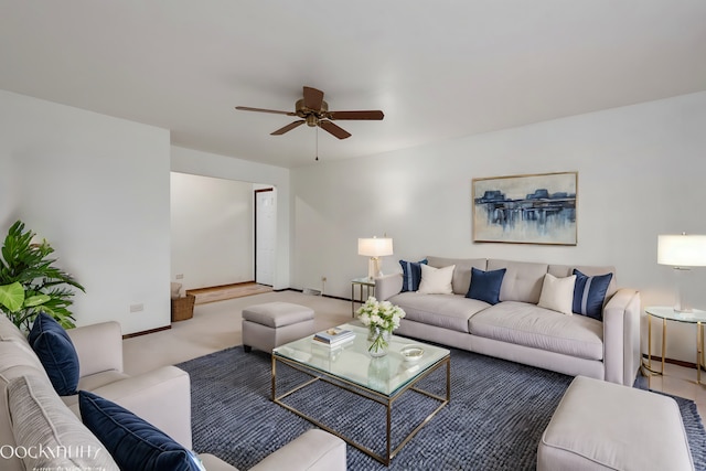 carpeted living room featuring ceiling fan