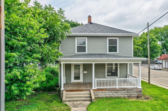 view of front of home featuring covered porch