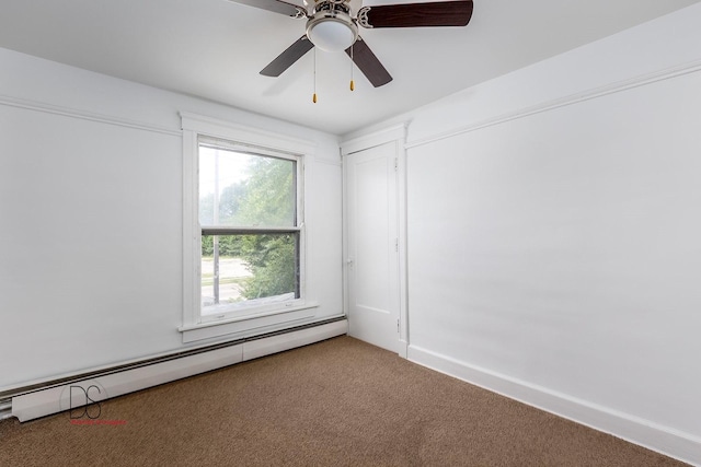 empty room featuring carpet, ceiling fan, and a baseboard heating unit