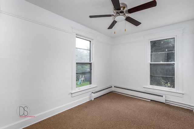 carpeted spare room with ceiling fan and baseboard heating