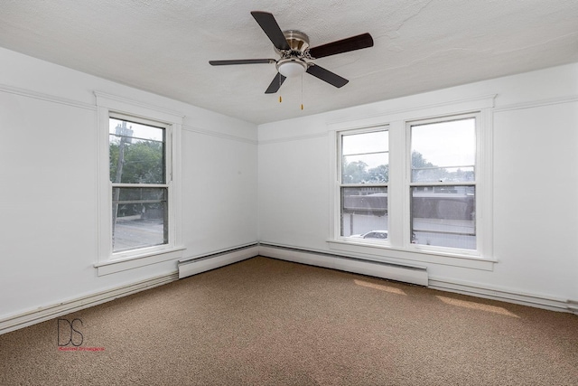 spare room featuring carpet flooring, a textured ceiling, and ceiling fan