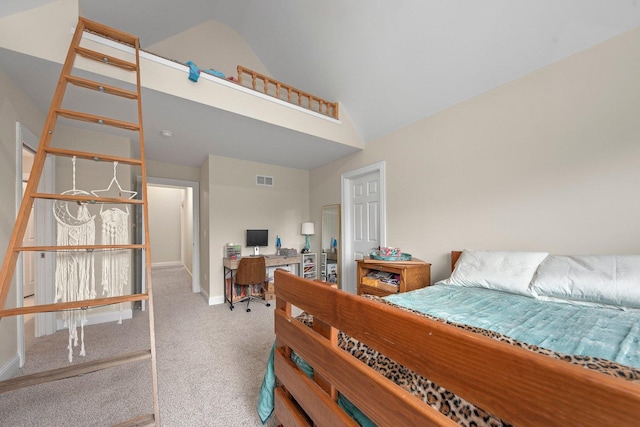 carpeted bedroom featuring lofted ceiling