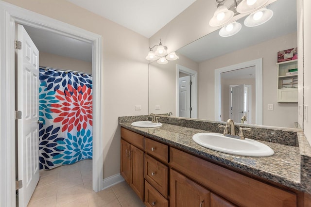 bathroom with tile patterned floors and vanity