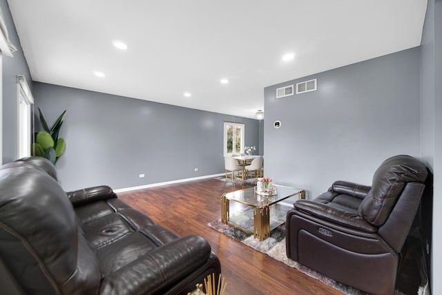 living room with dark hardwood / wood-style floors