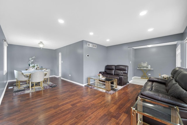 living room with dark hardwood / wood-style floors