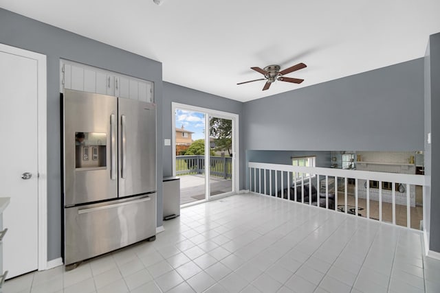 kitchen with white cabinets, ceiling fan, stainless steel fridge with ice dispenser, and light tile patterned floors