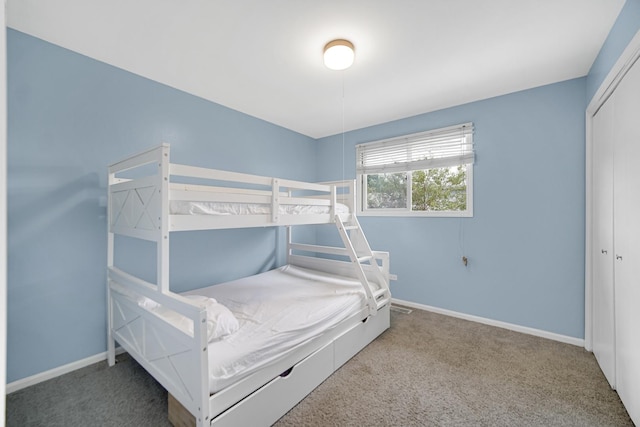 bedroom with carpet floors and a closet