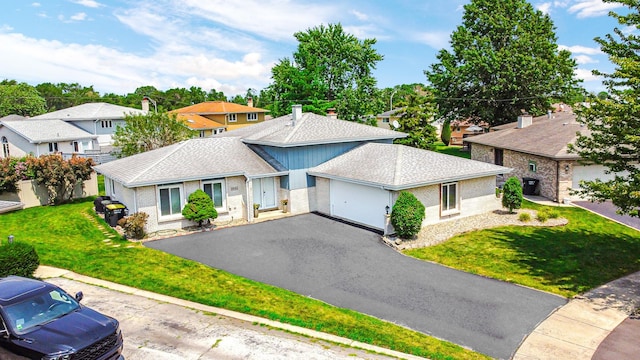 tri-level home featuring a front yard