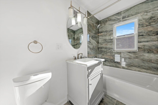 full bathroom featuring vanity, toilet, and tiled shower / bath