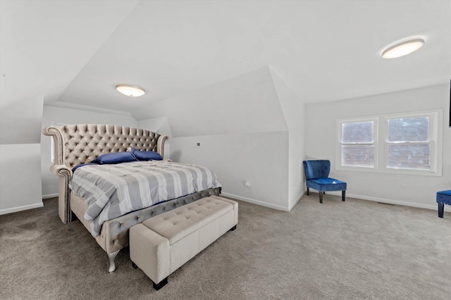 carpeted bedroom featuring lofted ceiling