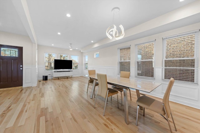 dining room featuring light hardwood / wood-style flooring and an inviting chandelier