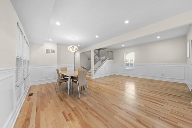 dining space with light wood-type flooring