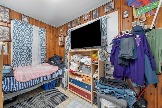 bedroom featuring wooden walls