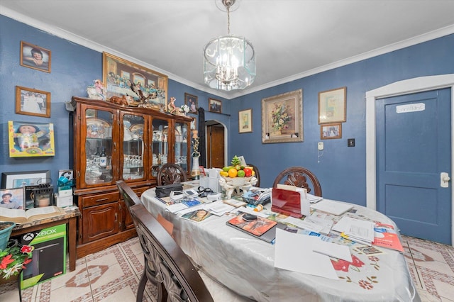 dining space featuring crown molding and a notable chandelier