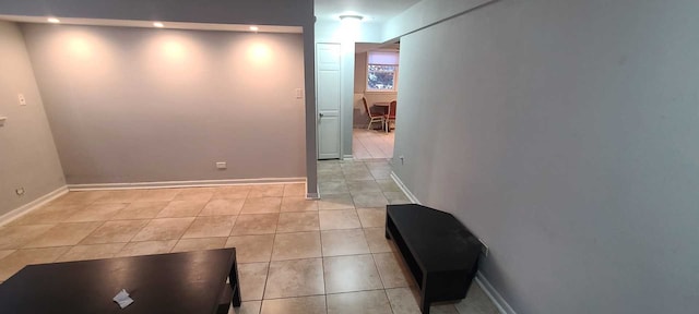 hallway featuring light tile patterned floors