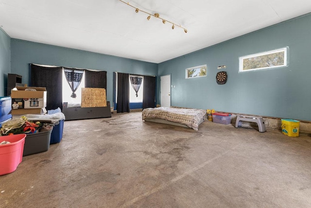 bedroom with carpet and rail lighting