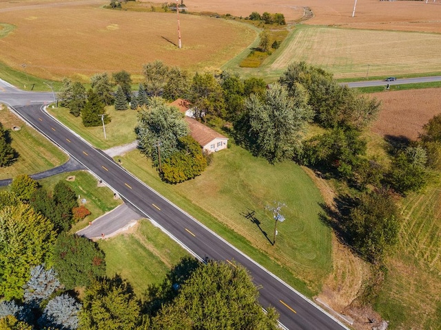 birds eye view of property with a rural view