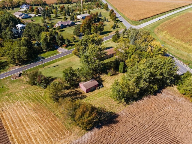 birds eye view of property with a rural view