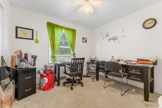 office space with ceiling fan and light carpet