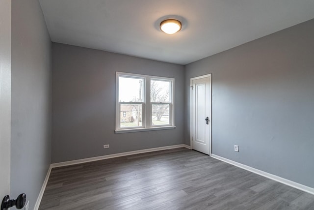 spare room featuring dark hardwood / wood-style floors