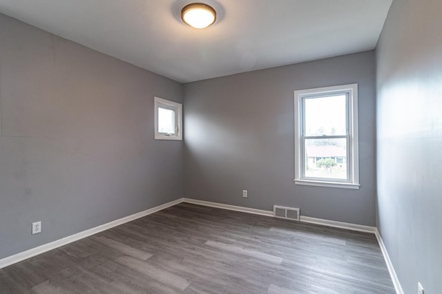 empty room with hardwood / wood-style floors