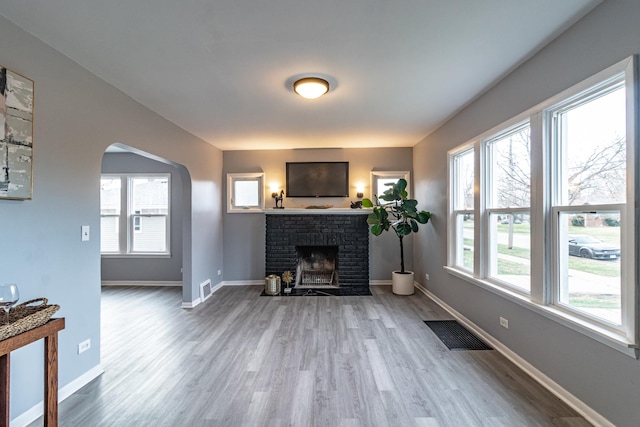 living room featuring hardwood / wood-style floors and a fireplace