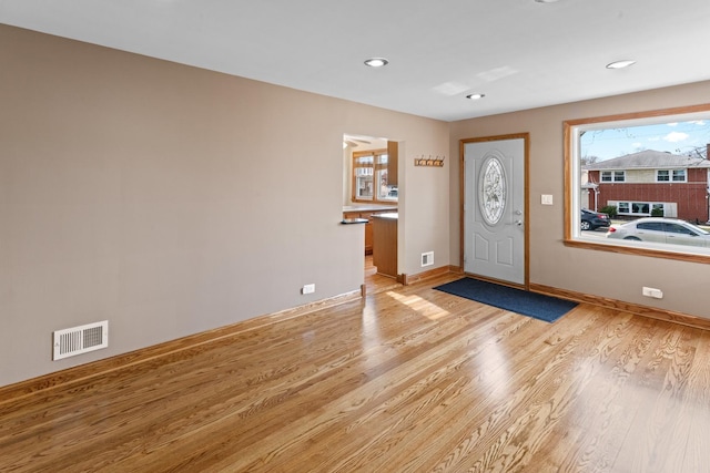 entryway with light hardwood / wood-style floors