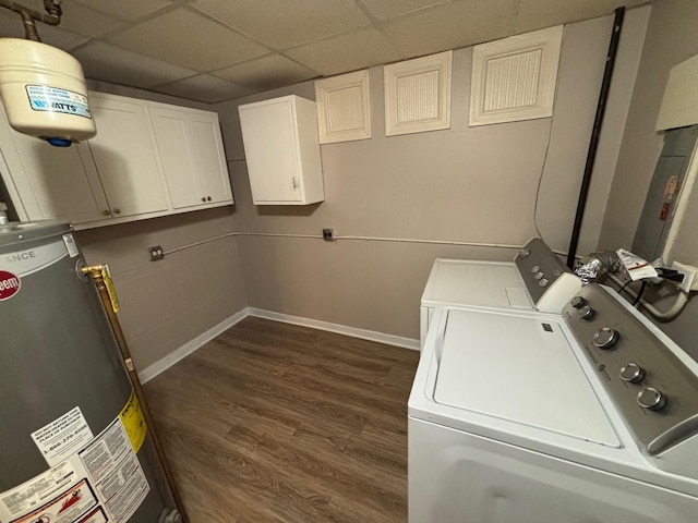 clothes washing area with dark hardwood / wood-style floors, cabinets, separate washer and dryer, and water heater