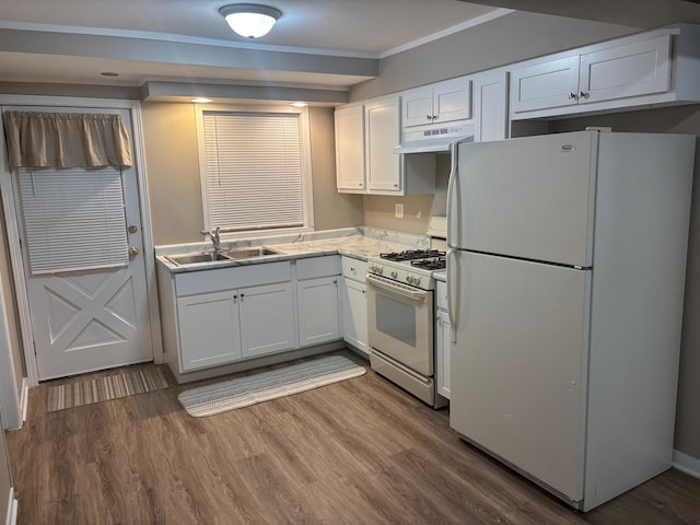 kitchen with white cabinets, white refrigerator, sink, gas range, and hardwood / wood-style flooring