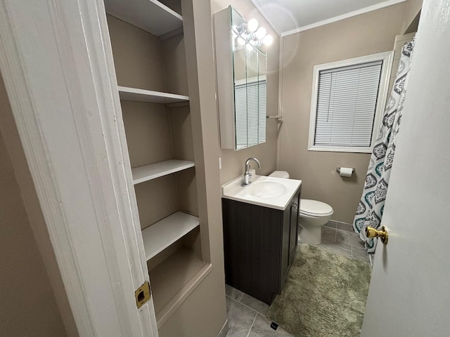 bathroom featuring tile patterned floors, vanity, and toilet