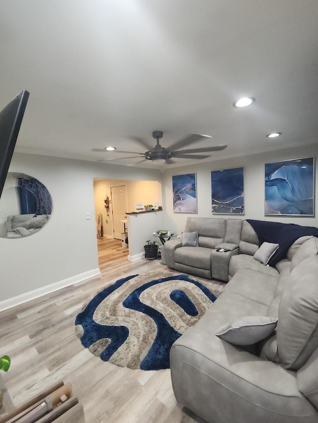 living room featuring ceiling fan and hardwood / wood-style floors