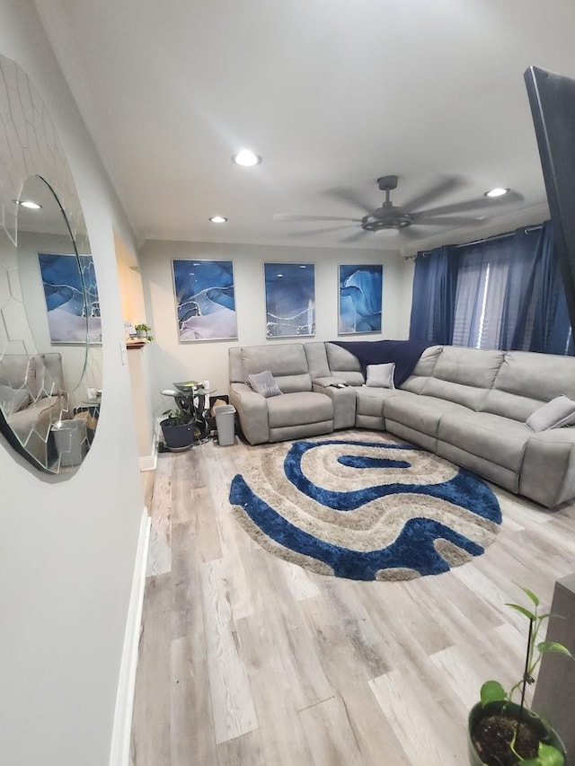 living room with ceiling fan and wood-type flooring