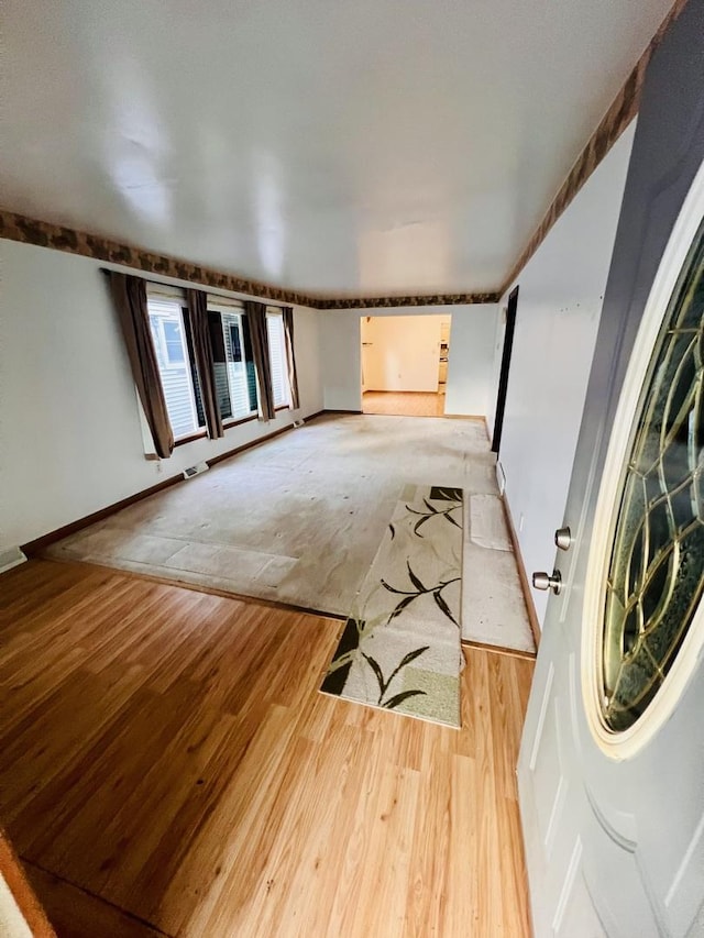 spare room featuring light wood-type flooring